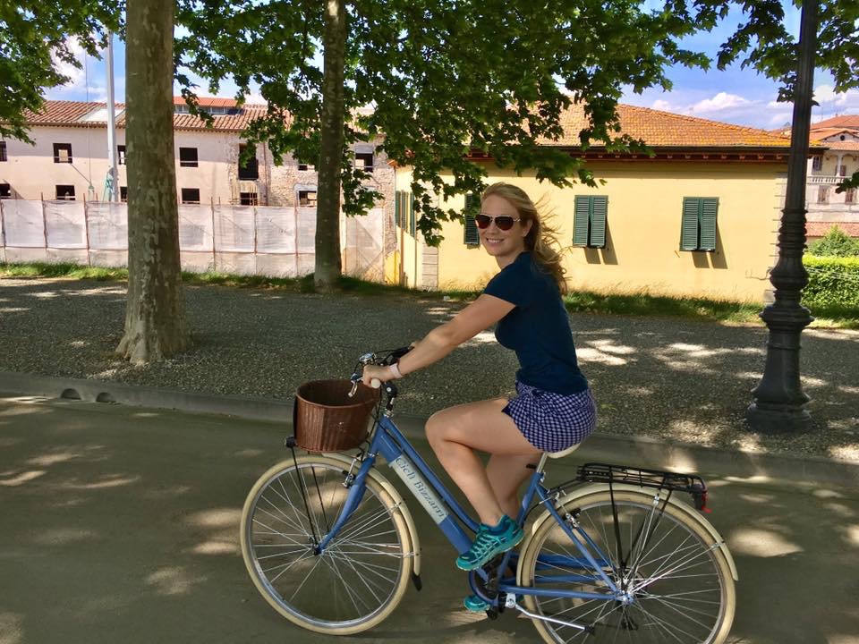 Heather riding bike on the city walls of Lucca